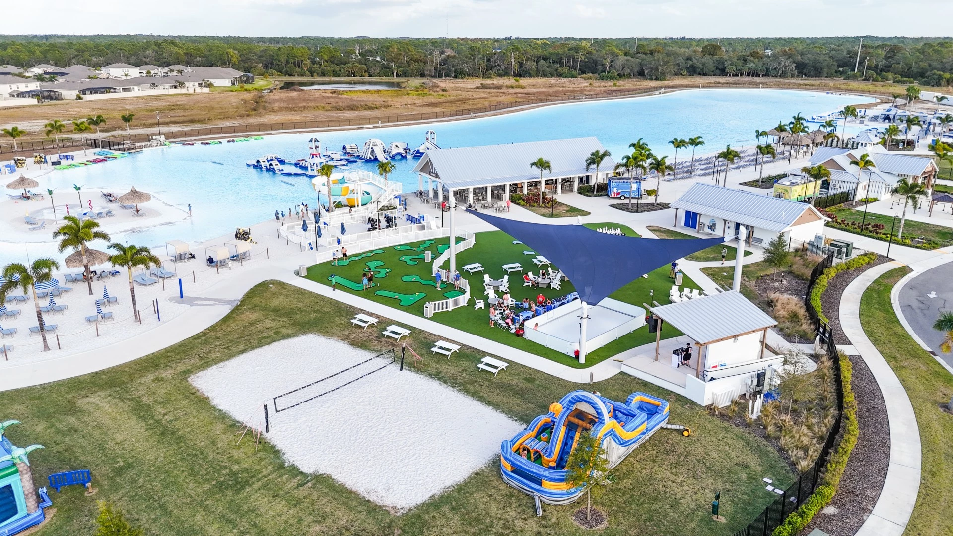 a swimming pool with a water park and a playground