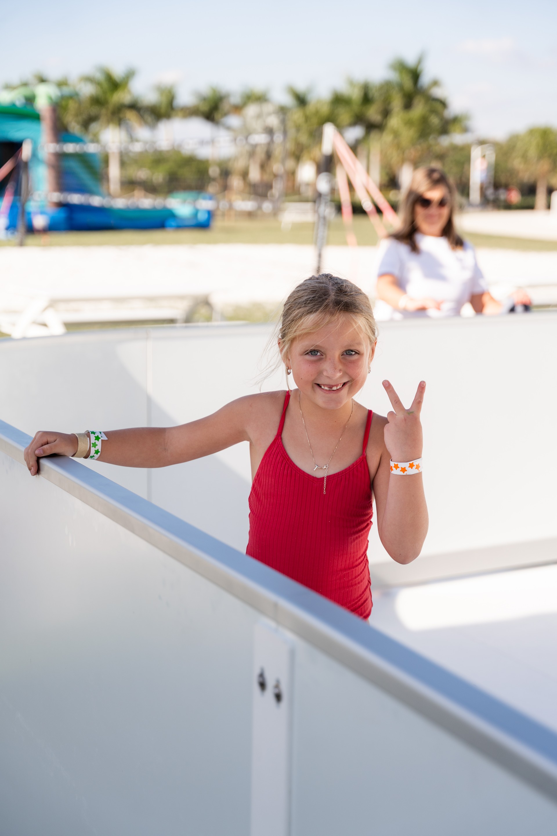 a girl standing in a red dress
