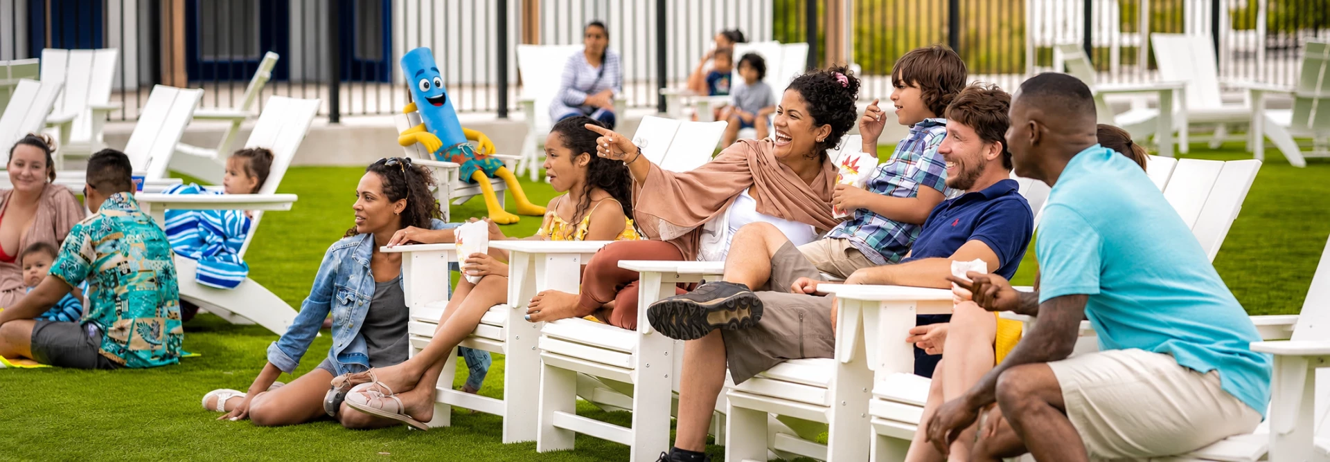 a woman and children sitting in chairs