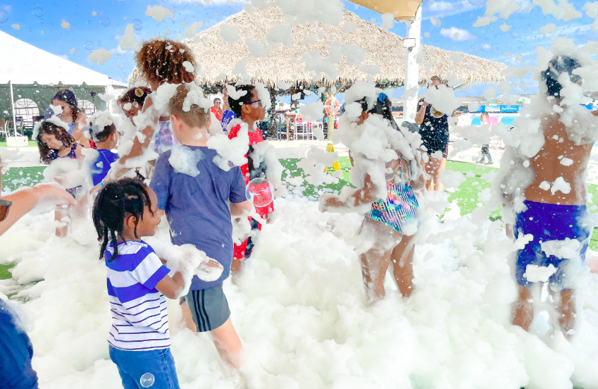 a group of kids playing with foam