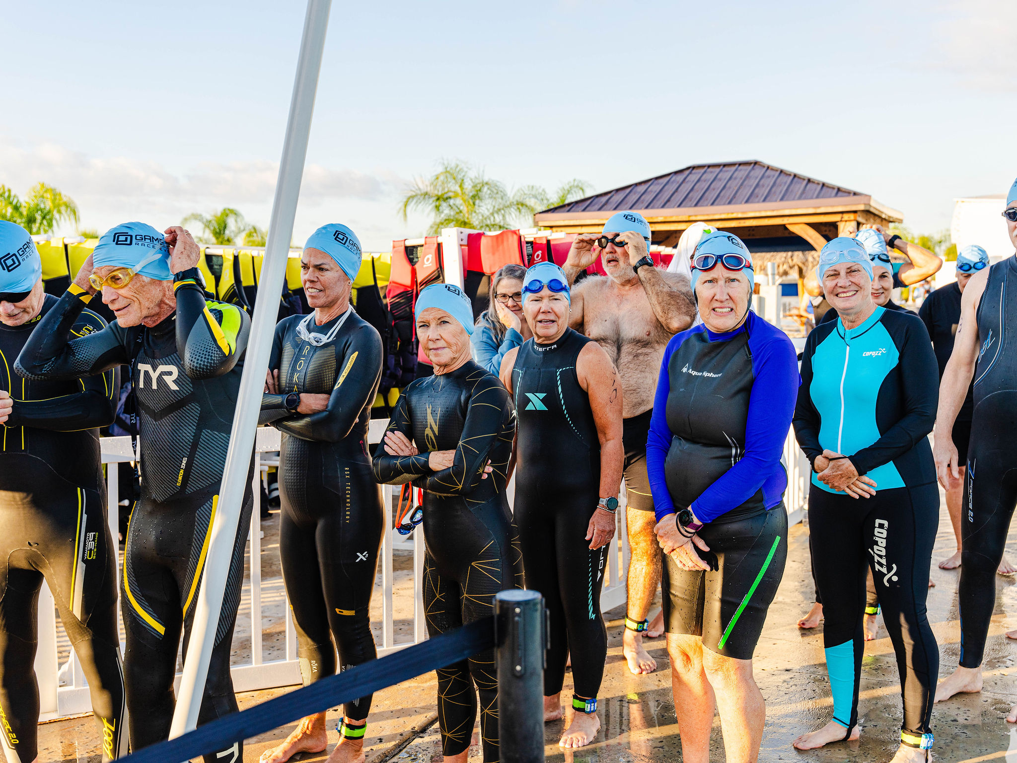 a group of people in wet suits
