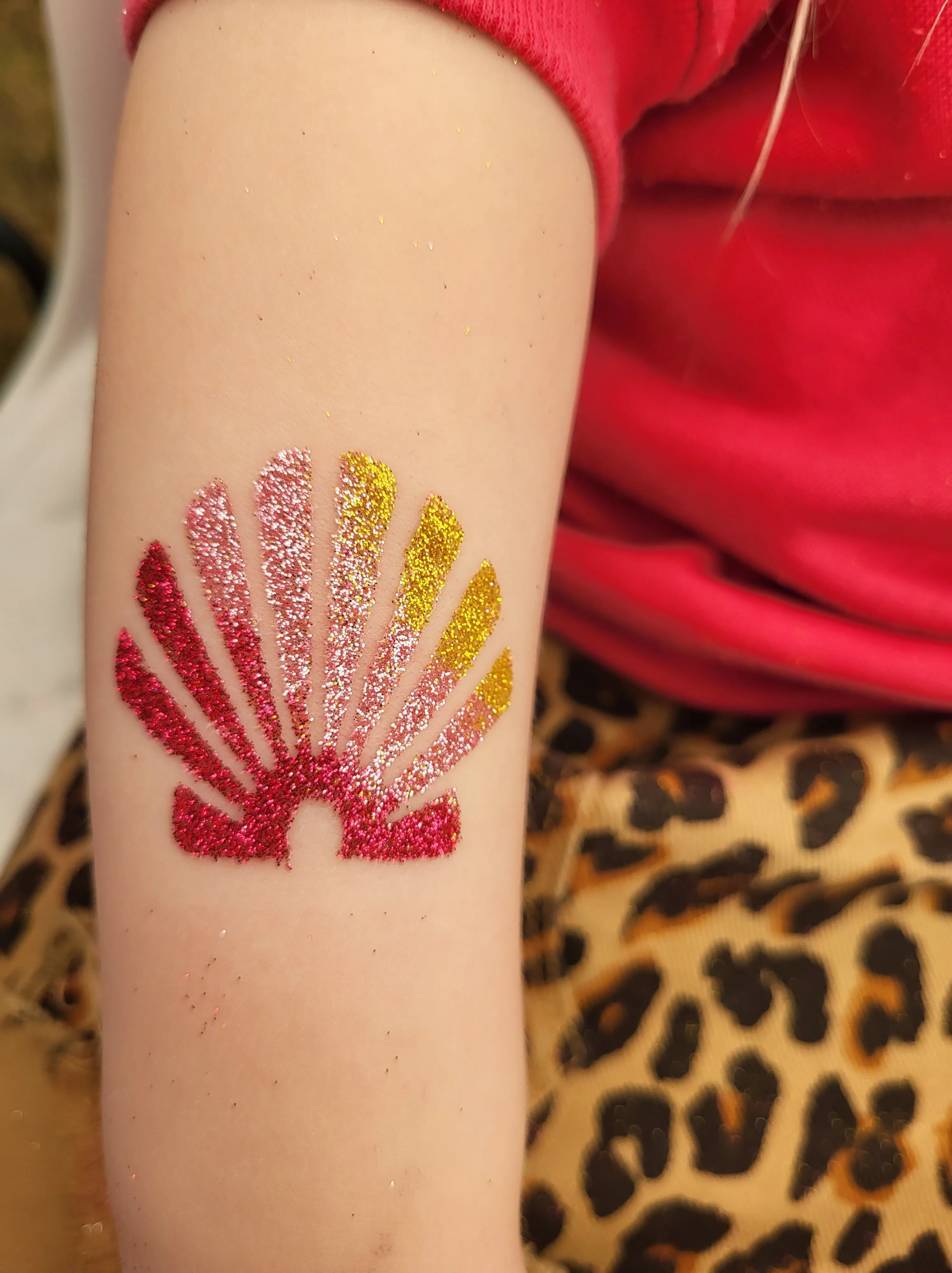 a person with glitter on their arm