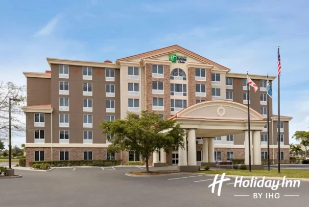 a large building with flags in front of it