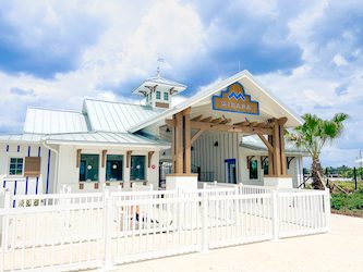 a white building with a white fence