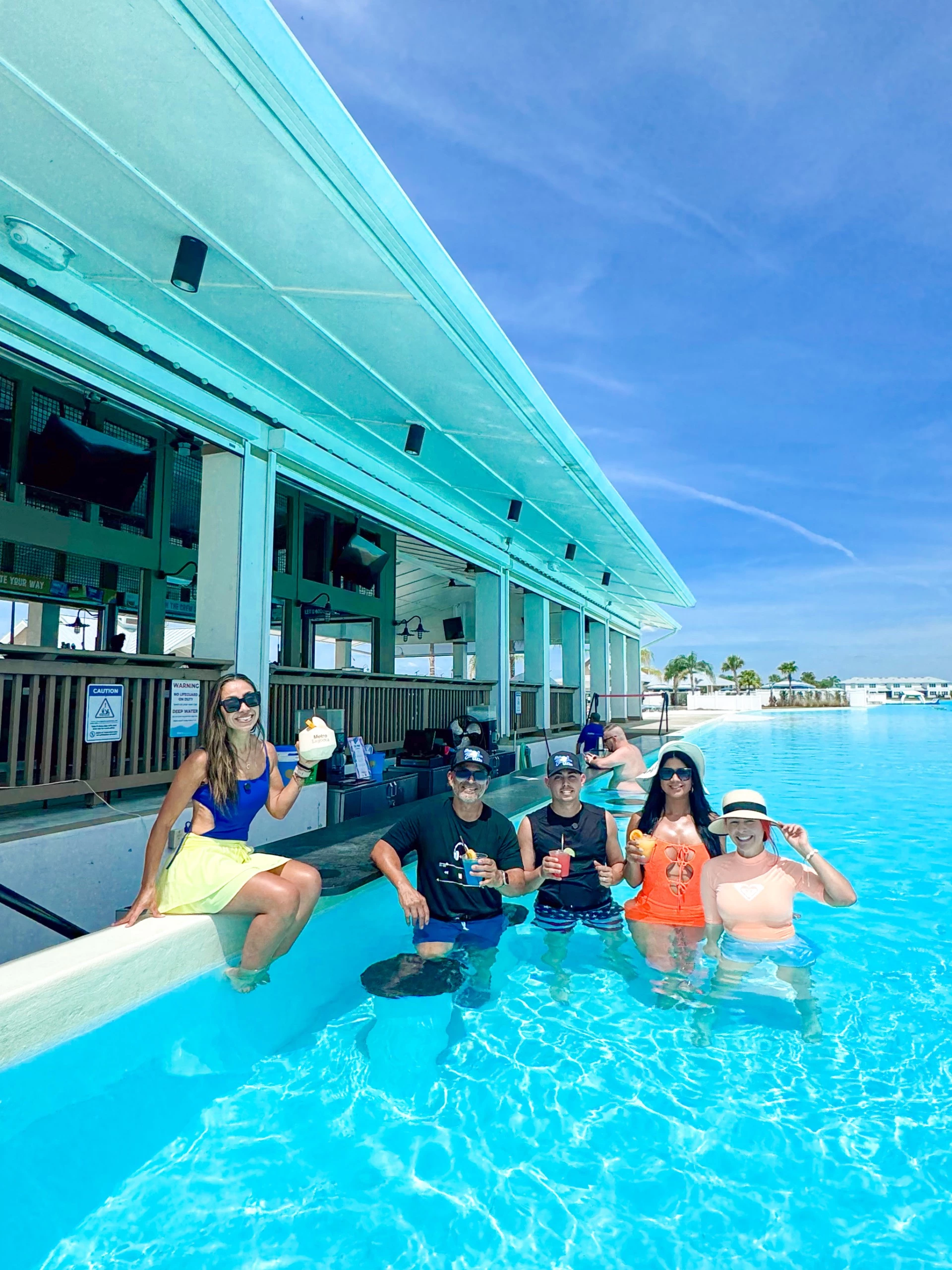 a group of people sitting in a pool