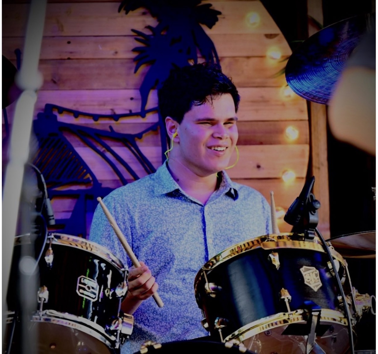 a man playing a drum set