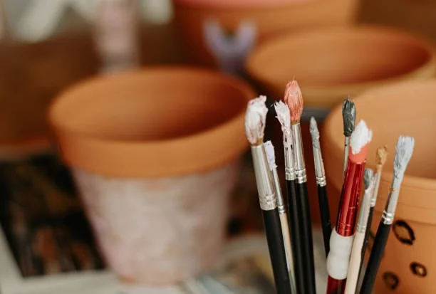 paint brushes in a vase