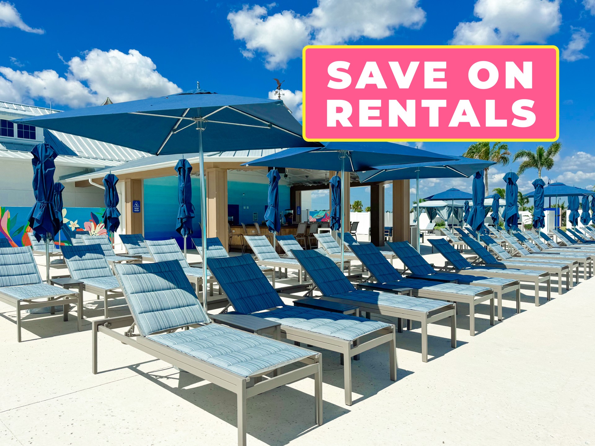 a group of chairs and umbrellas outside of a building