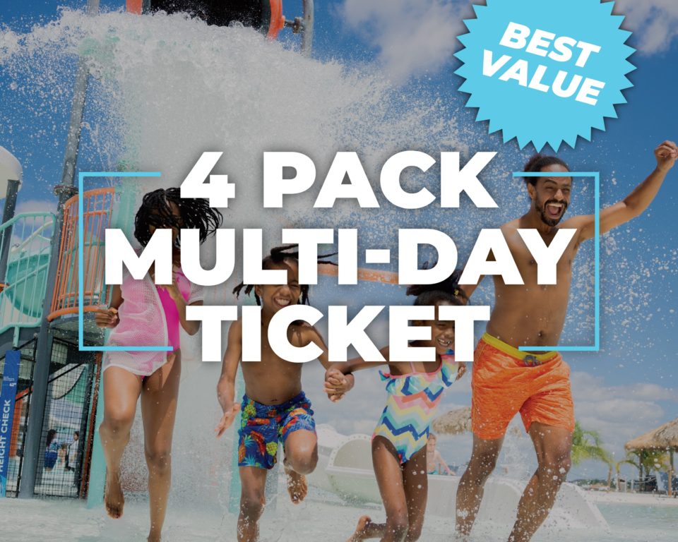 a group of people running on a water slide