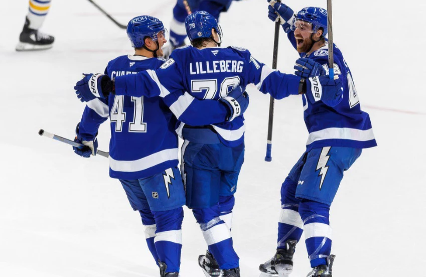 a group of hockey players celebrating