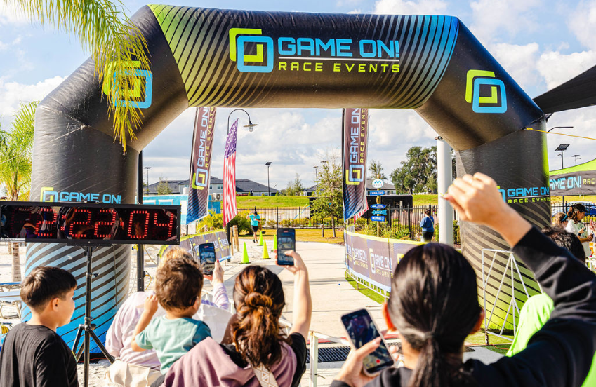a group of people taking pictures of a race
