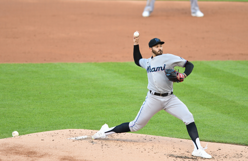 a baseball player throwing a ball
