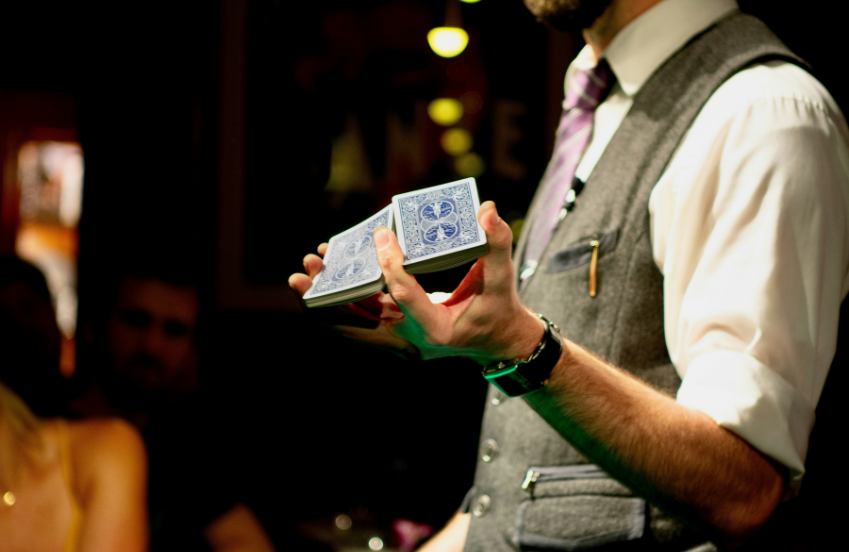 a man holding a deck of cards
