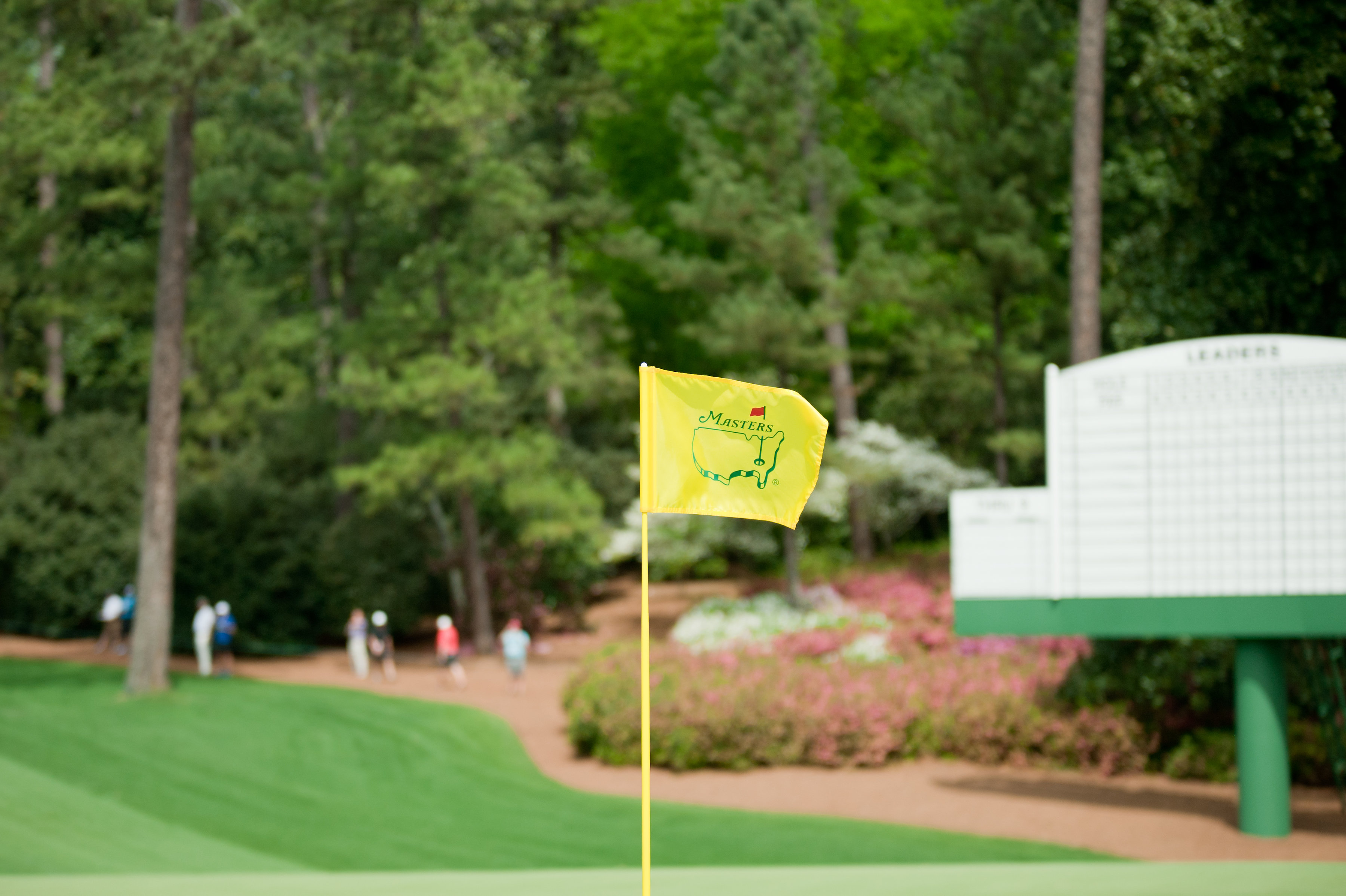 a yellow flag on a golf course