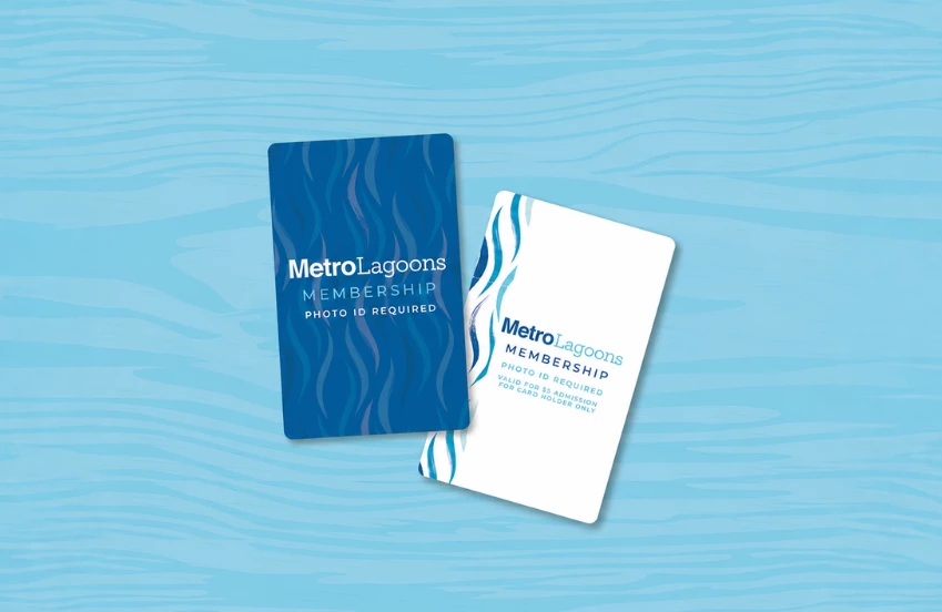 a pair of cards on a blue surface