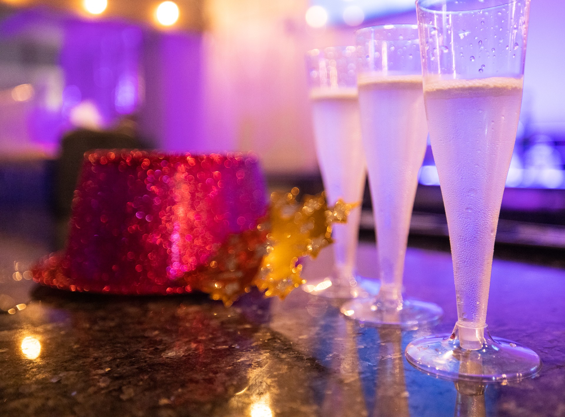 a group of champagne glasses on a table