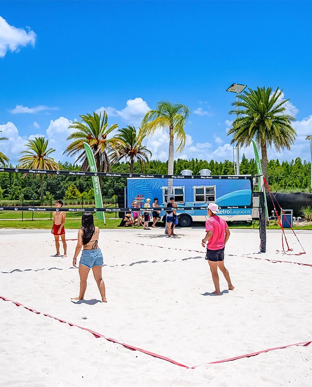 a group of people playing volleyball