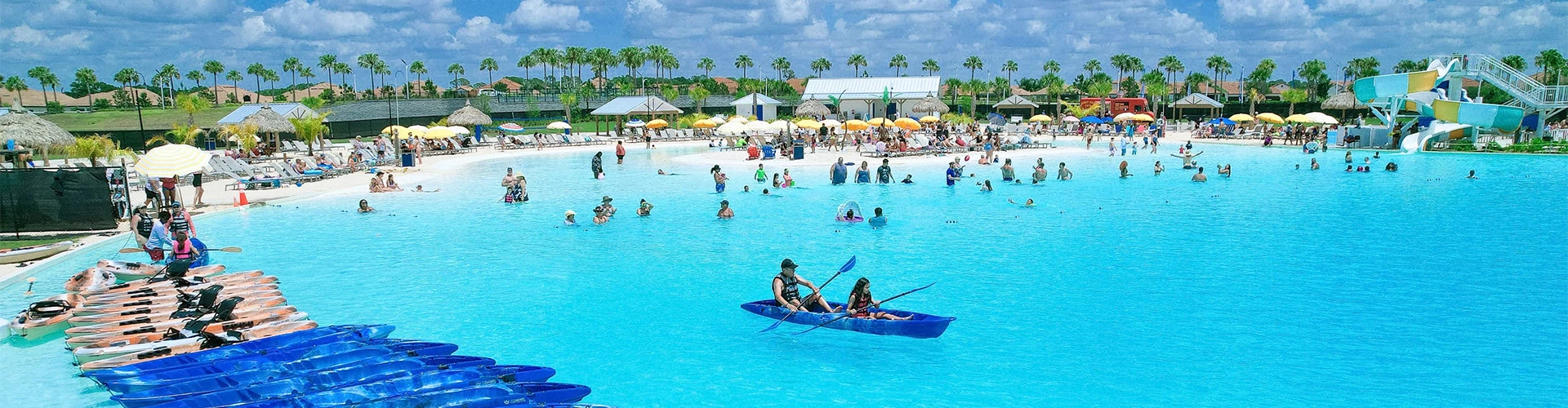 people in a blue canoe in a pool