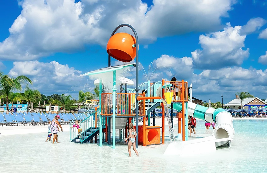 a water park with a water slide and people
