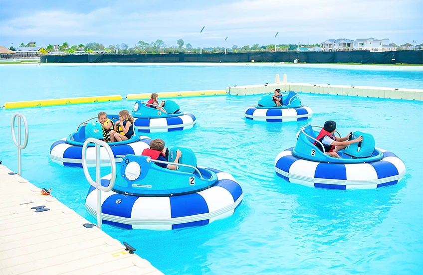 a group of kids on a bumper boat in a pool
