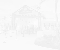 a white background with a building and a gate