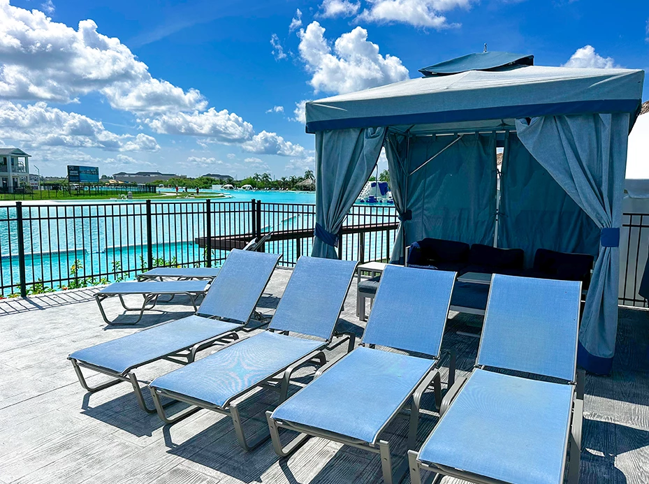 a group of blue chairs on a deck