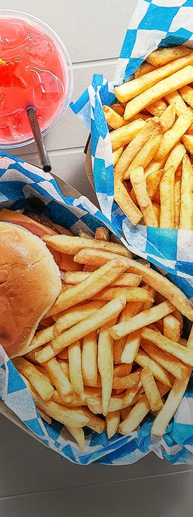 a burger and fries in a basket