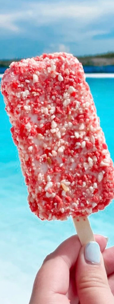 a close up of a red and white ice cream bar