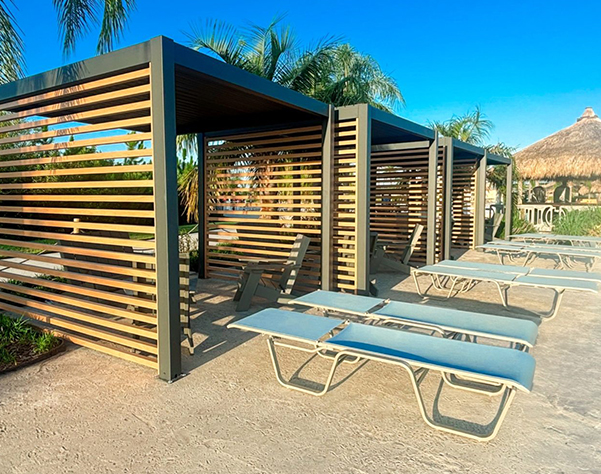a group of lounge chairs and a shelter