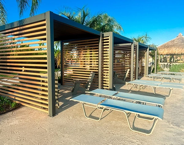a group of lounge chairs and a shelter