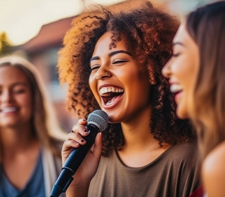 a woman singing into a microphone