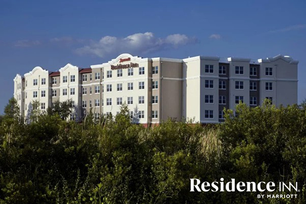 a building with trees in the background