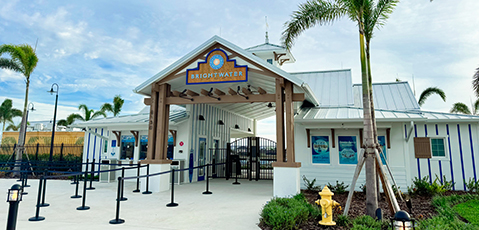 a building with a sign and a fire hydrant