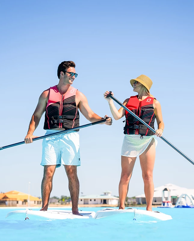 a man and woman on a paddle boat