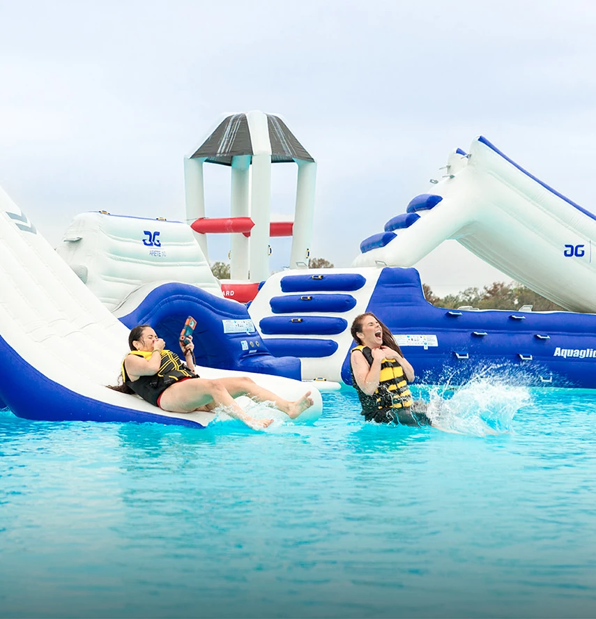 two women on a water slide