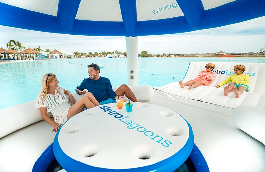 a man and woman sitting on a floating raft