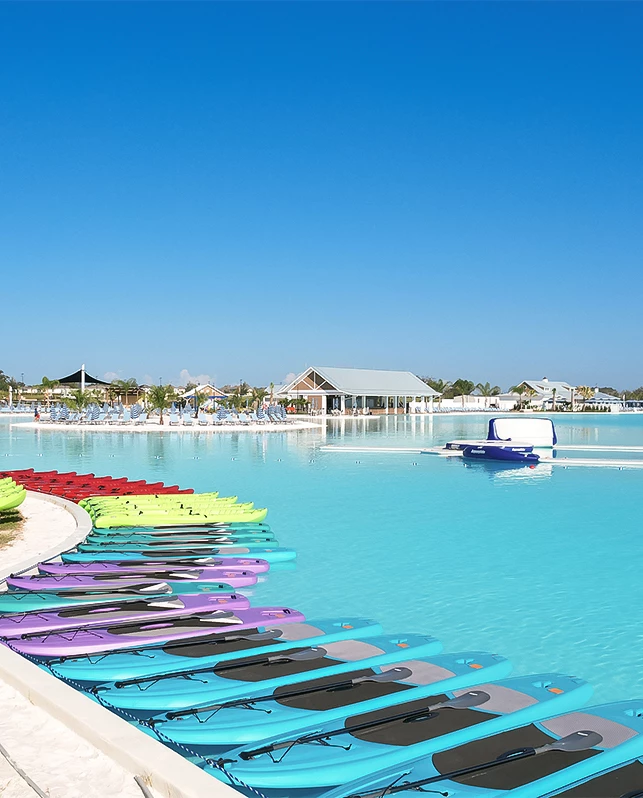 a row of paddle boards in a pool
