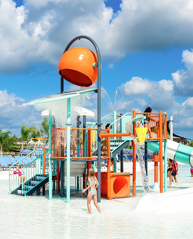 a water park with a water slide and people
