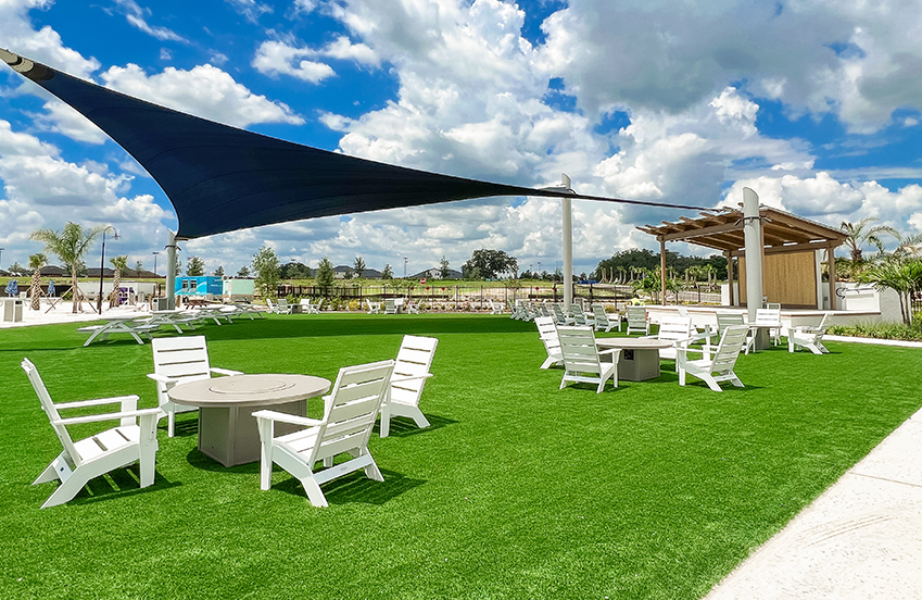 a patio area with chairs and tables