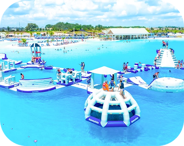 a large pool with people and floating rafts