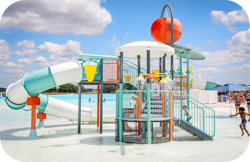 a water park with a slide and a pool