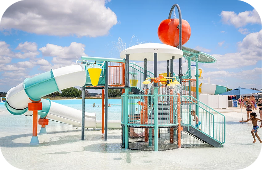 a water park with a slide and a pool