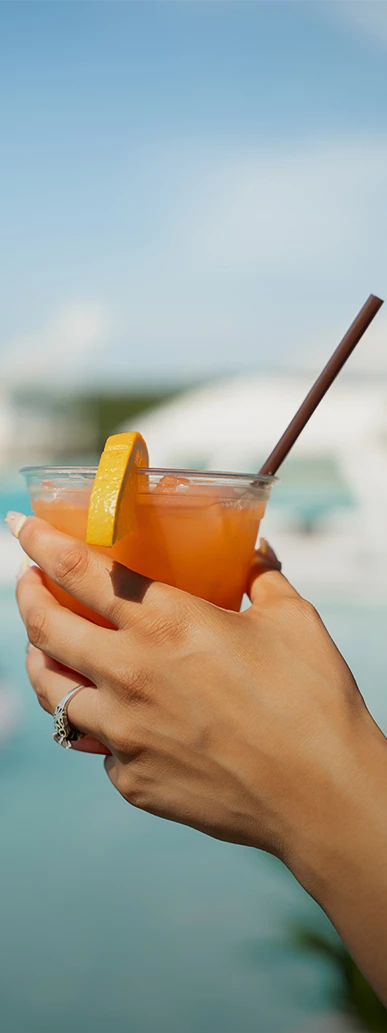 a person holding a drink