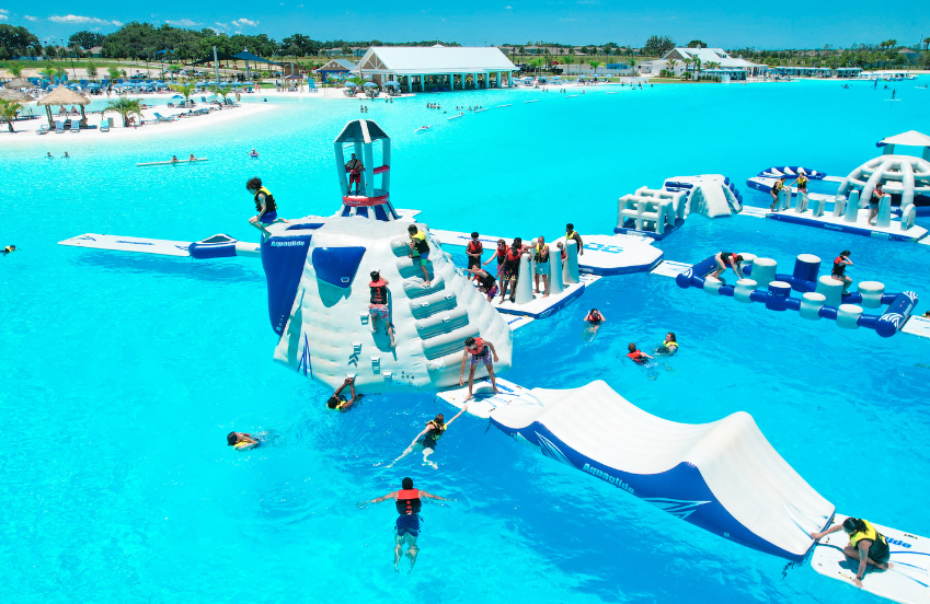 a group of people swimming in a pool