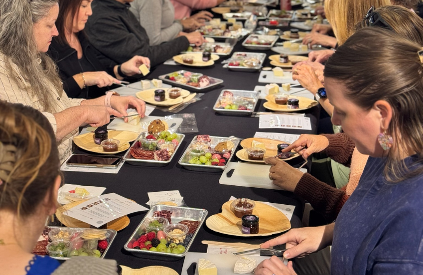 a group of people eating food at a table