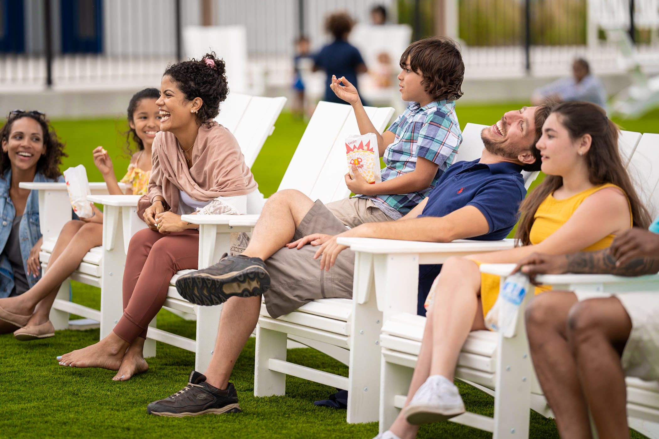 a group of people sitting on chairs
