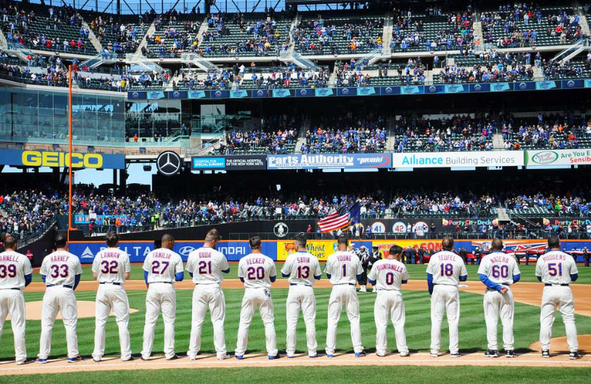 a group of baseball players in a stadium