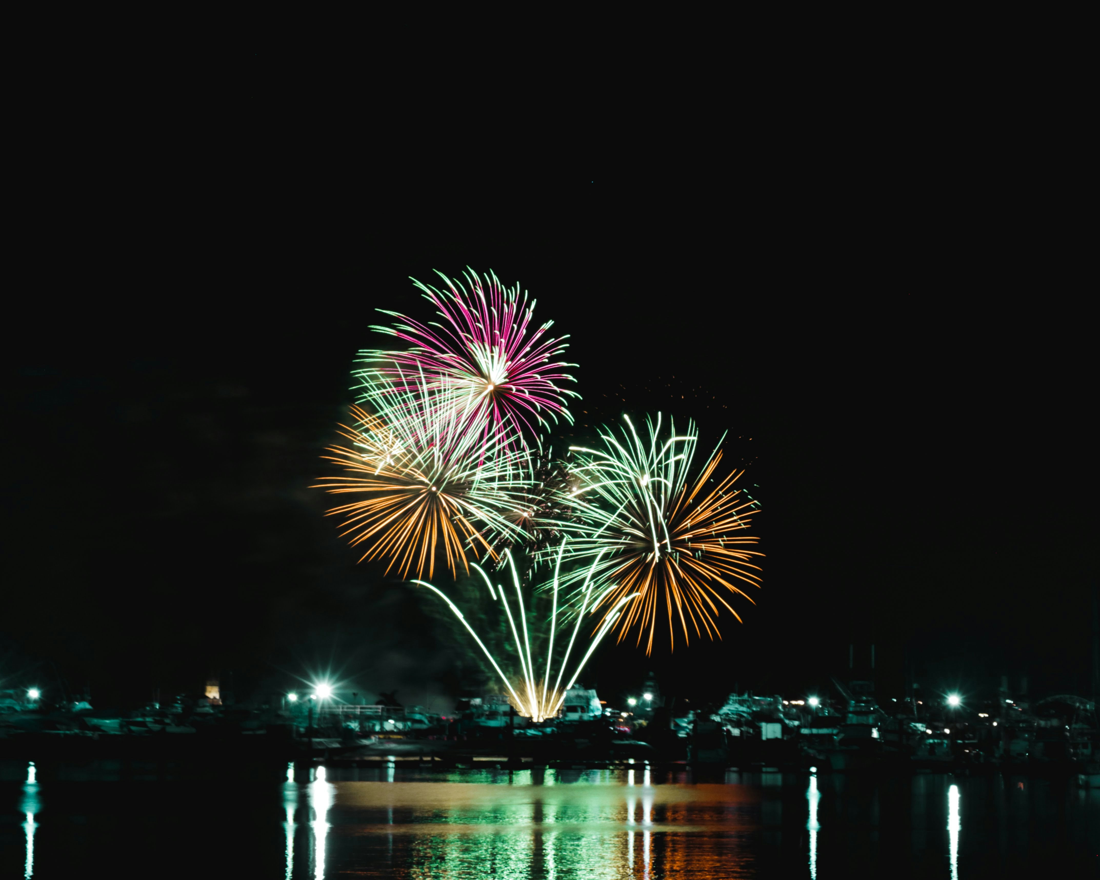 fireworks in the sky over water