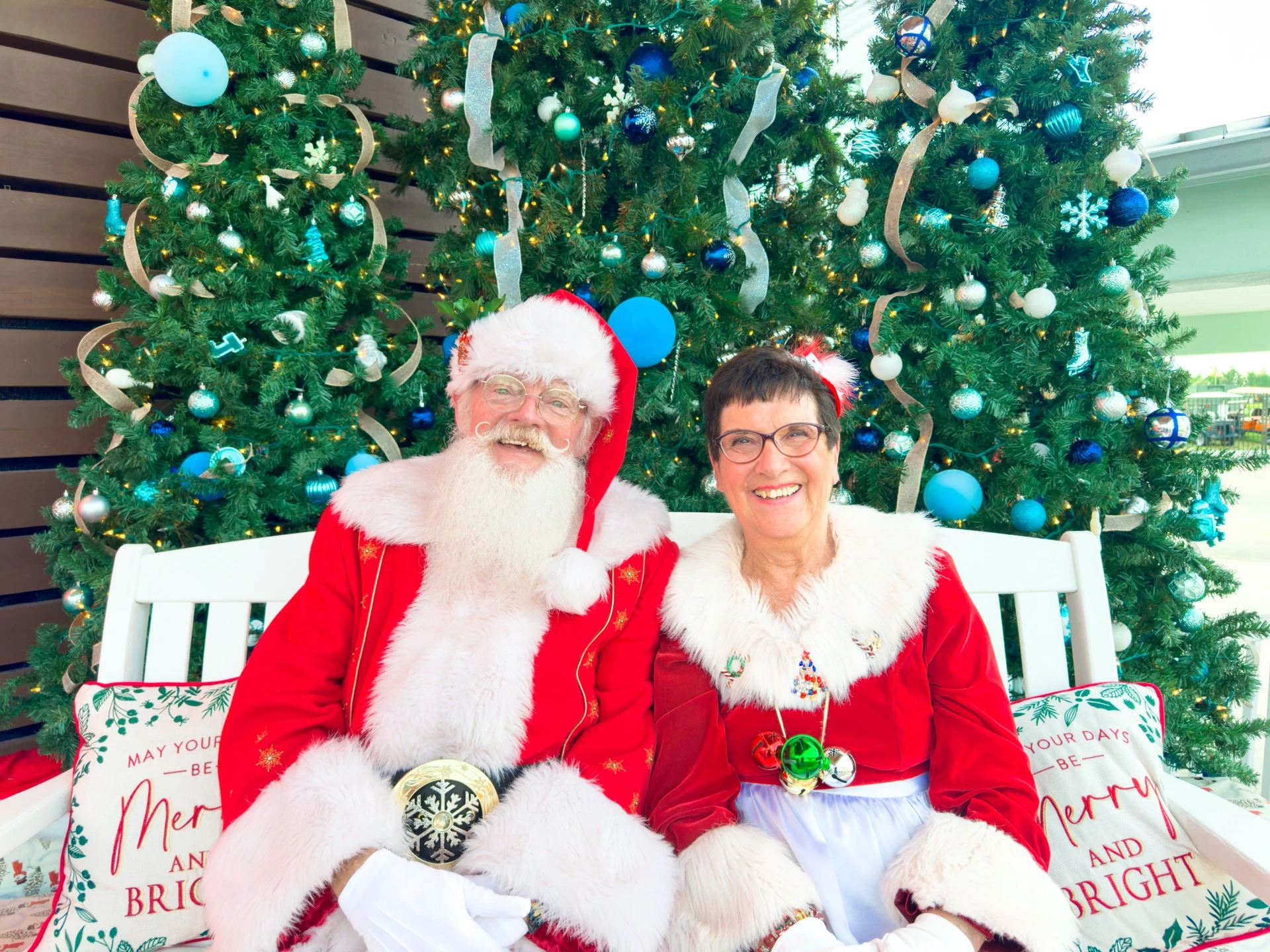 a man and woman in clothing posing for a picture