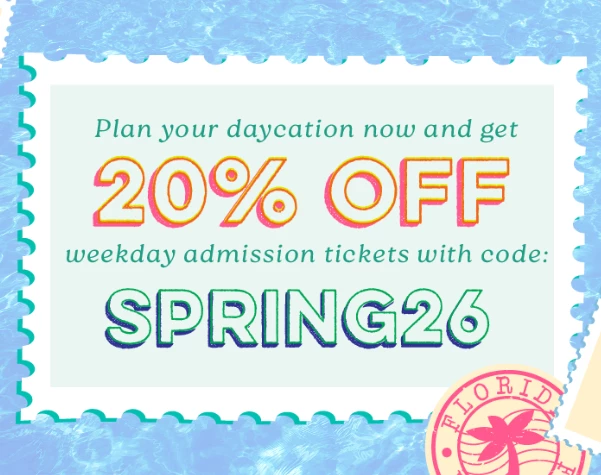 a white rectangular sign with text and a pink and green circle